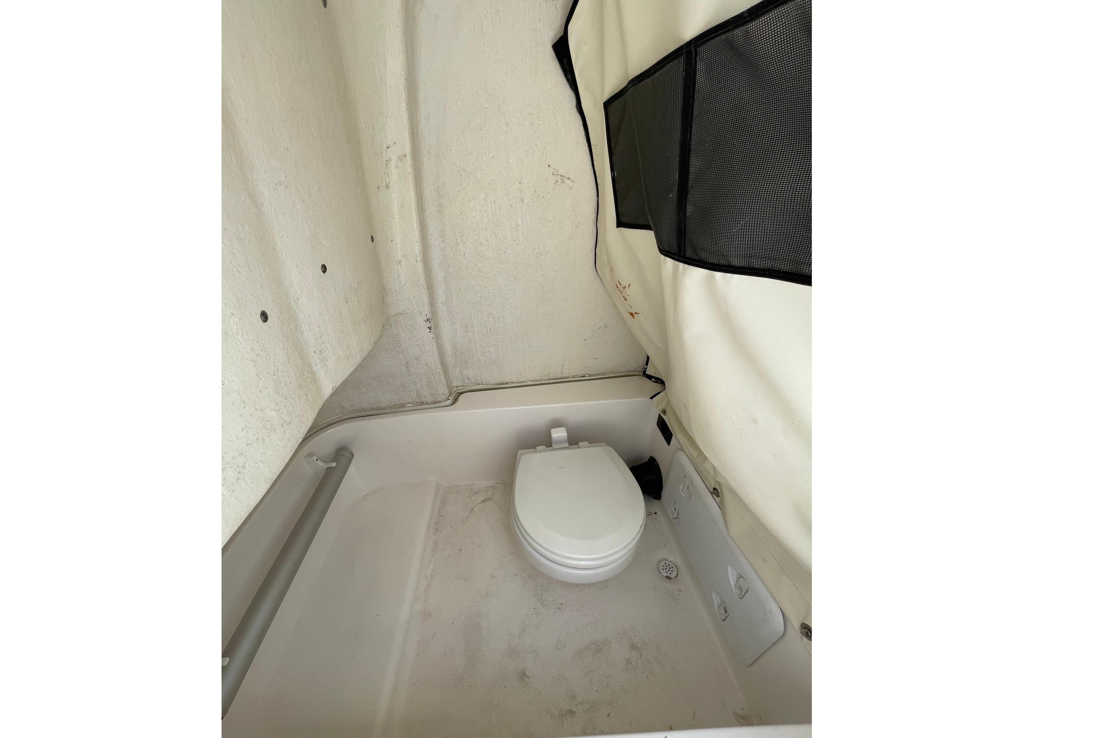 2022 Sea Fox 248 Commander boat interior with a compact marine toilet.