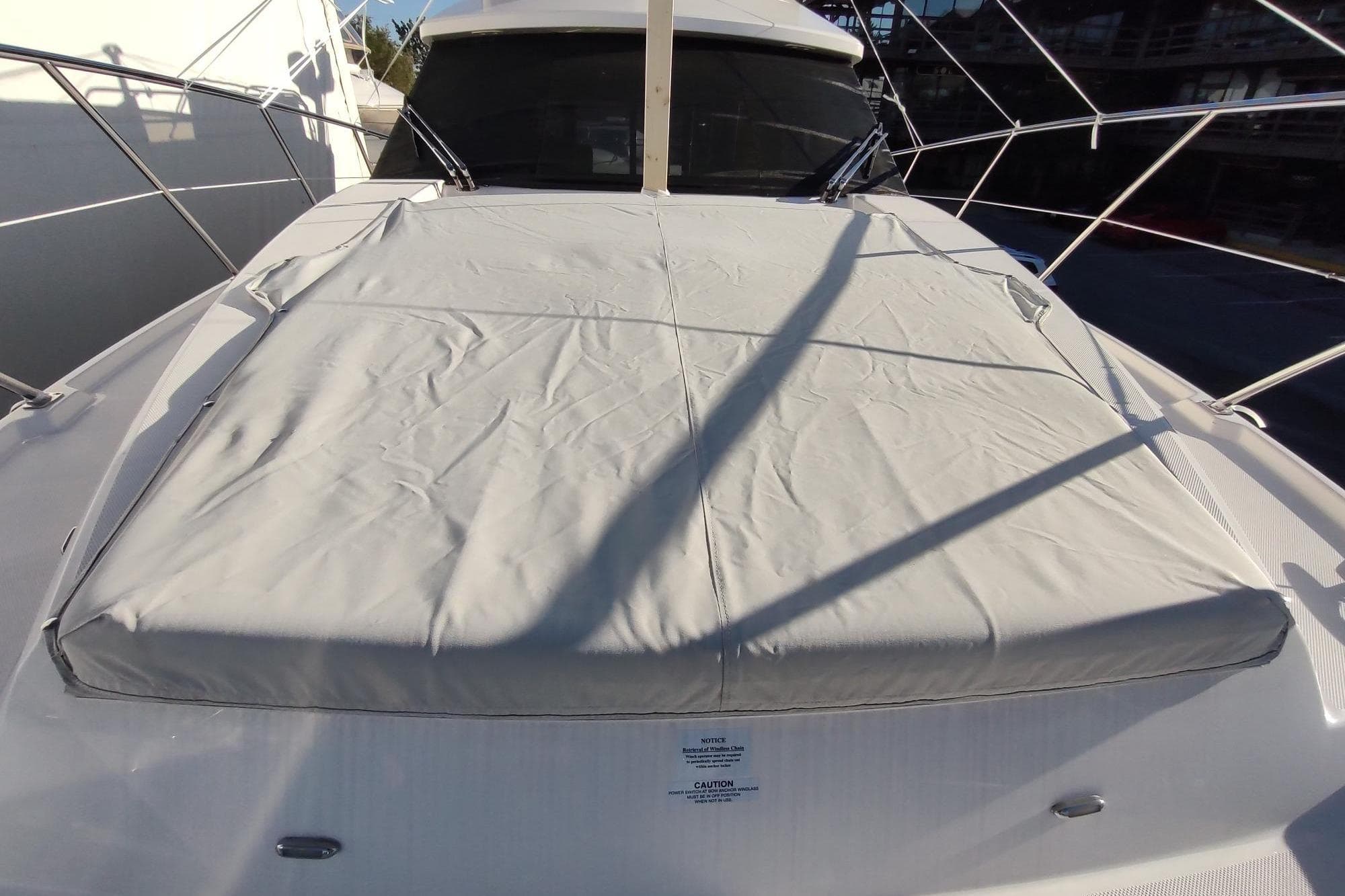 2021 Regal 42 Fly yacht with covered deck area and sleek design.