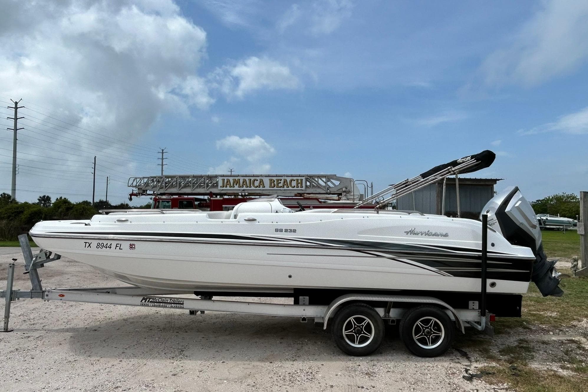 2018 Hurricane SunDeck Sport 232 OB boat on trailer at Jamaica Beach.