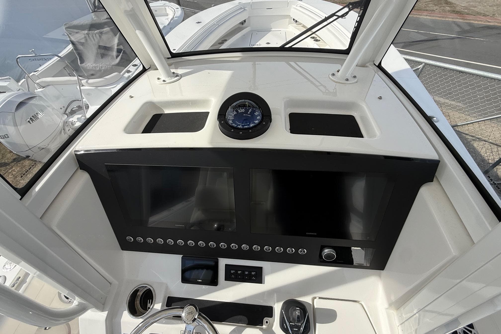 2024 Regulator 28 Forward Seating boat dashboard with navigation controls and compass.