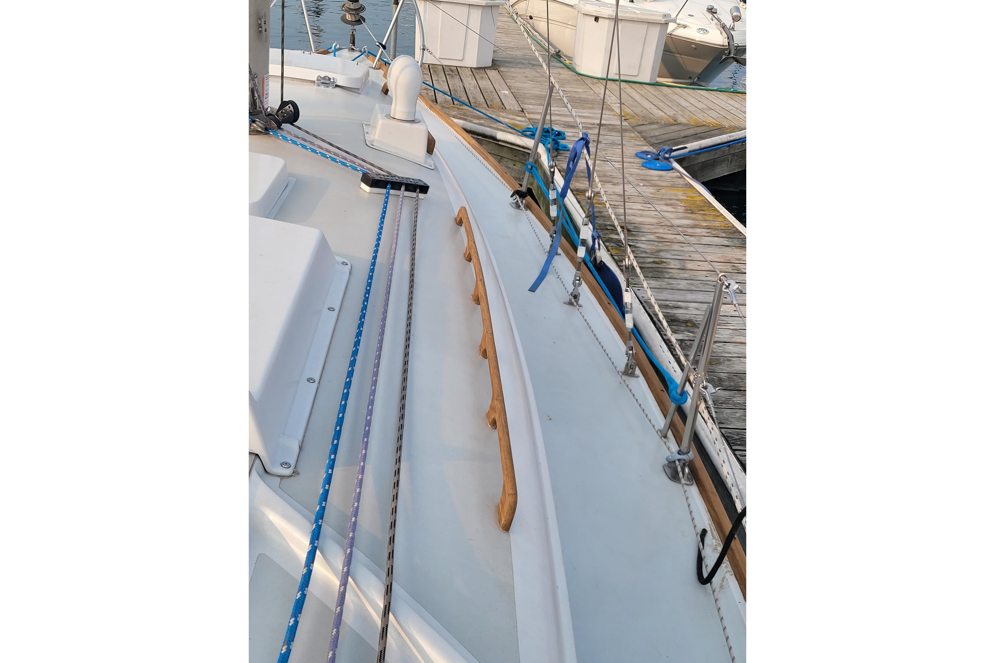 1971 Pearson 33 sailboat deck with ropes and dock view.