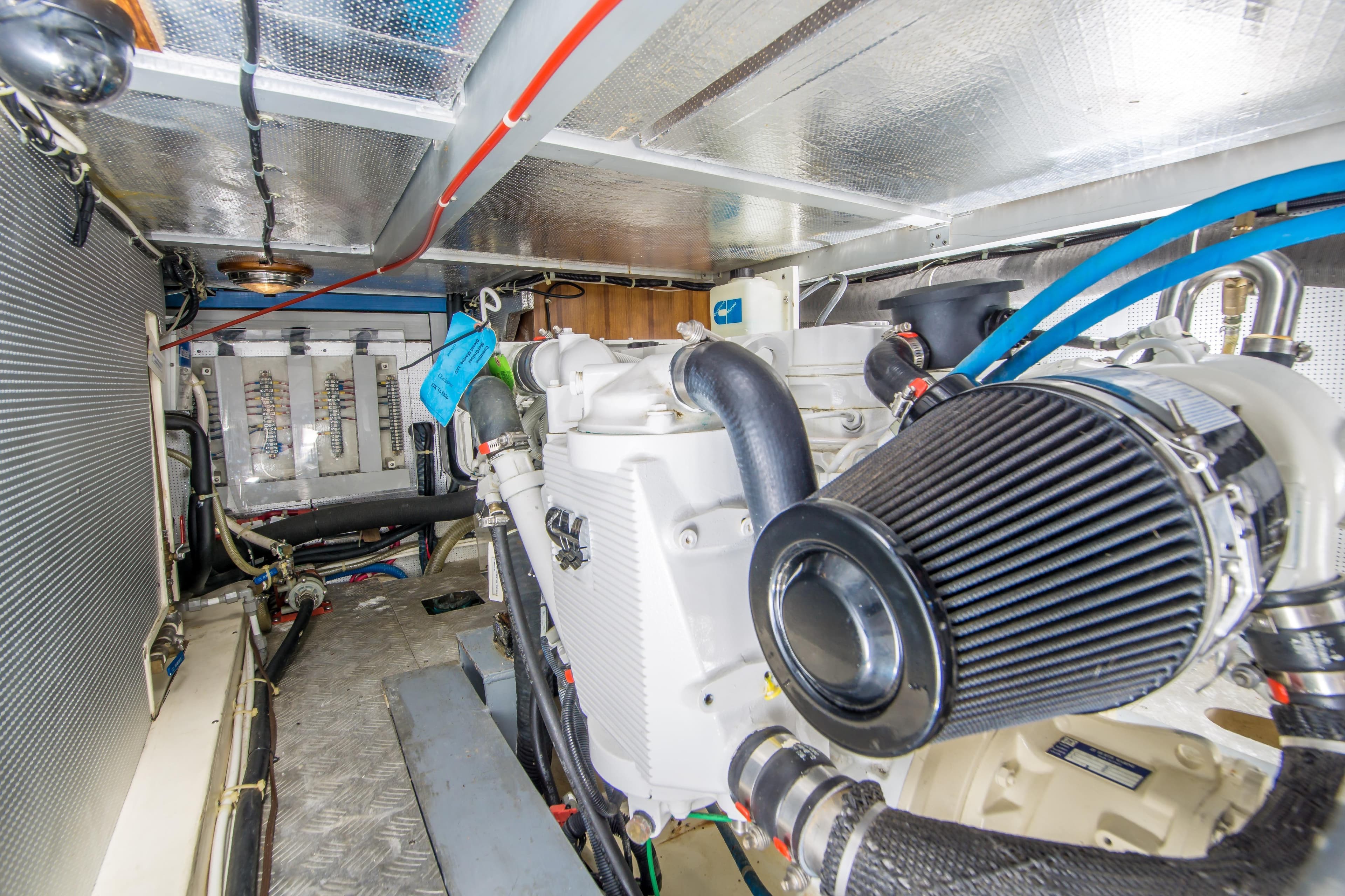 Engine room of 2008 North Pacific 43 Pilothouse with visible machinery and wiring.