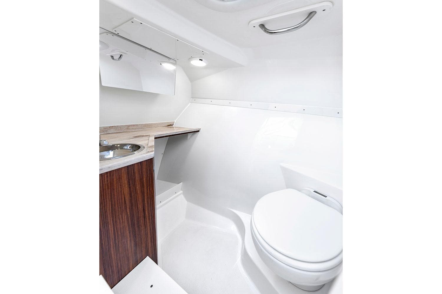 Manufacturer Provided Image: 2025 Pursuit DC 306 Dual Console boat bathroom with sink and toilet.
