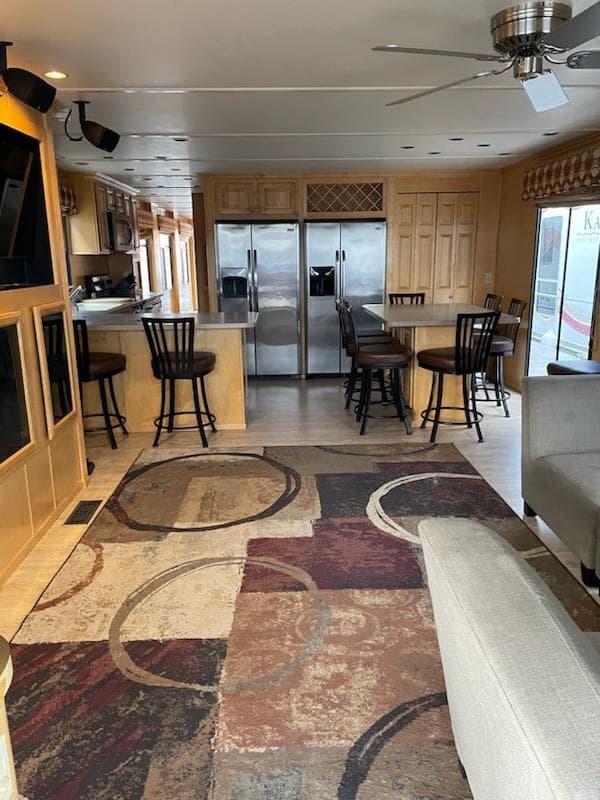 Interior of 2007 American Waterways Houseboat Sundancer Trip #17 with modern kitchen and seating area.