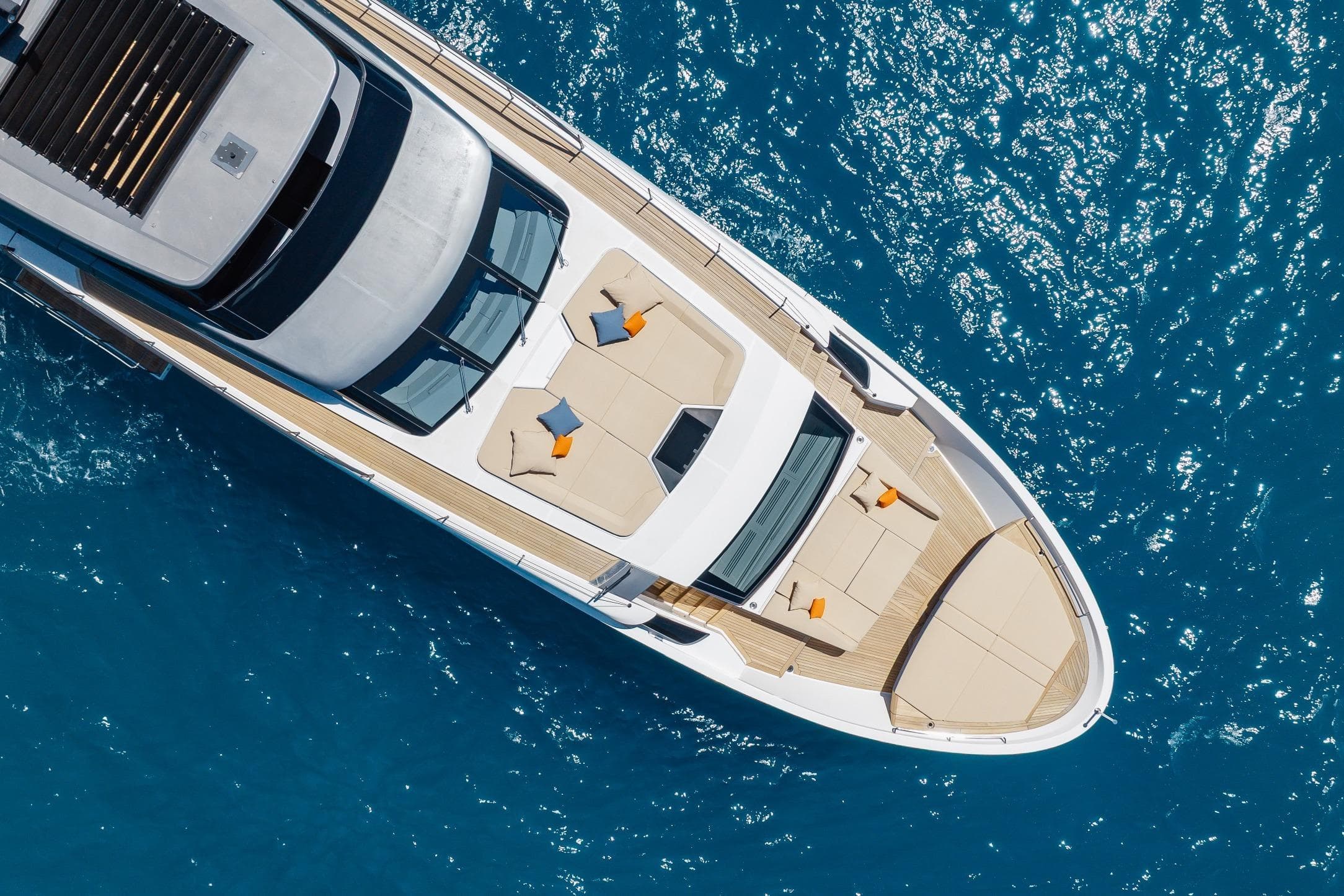 Aerial view of 2022 Sanlorenzo SL106A yacht on sparkling blue water.
