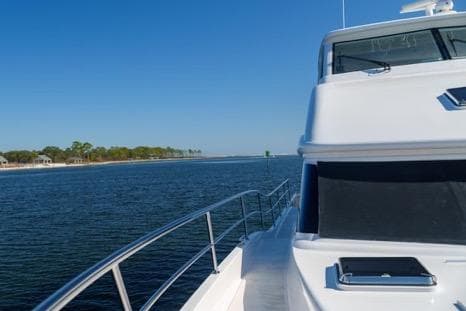 Luxury Horizon PC65 yacht cruising on open water, 2022 model.
