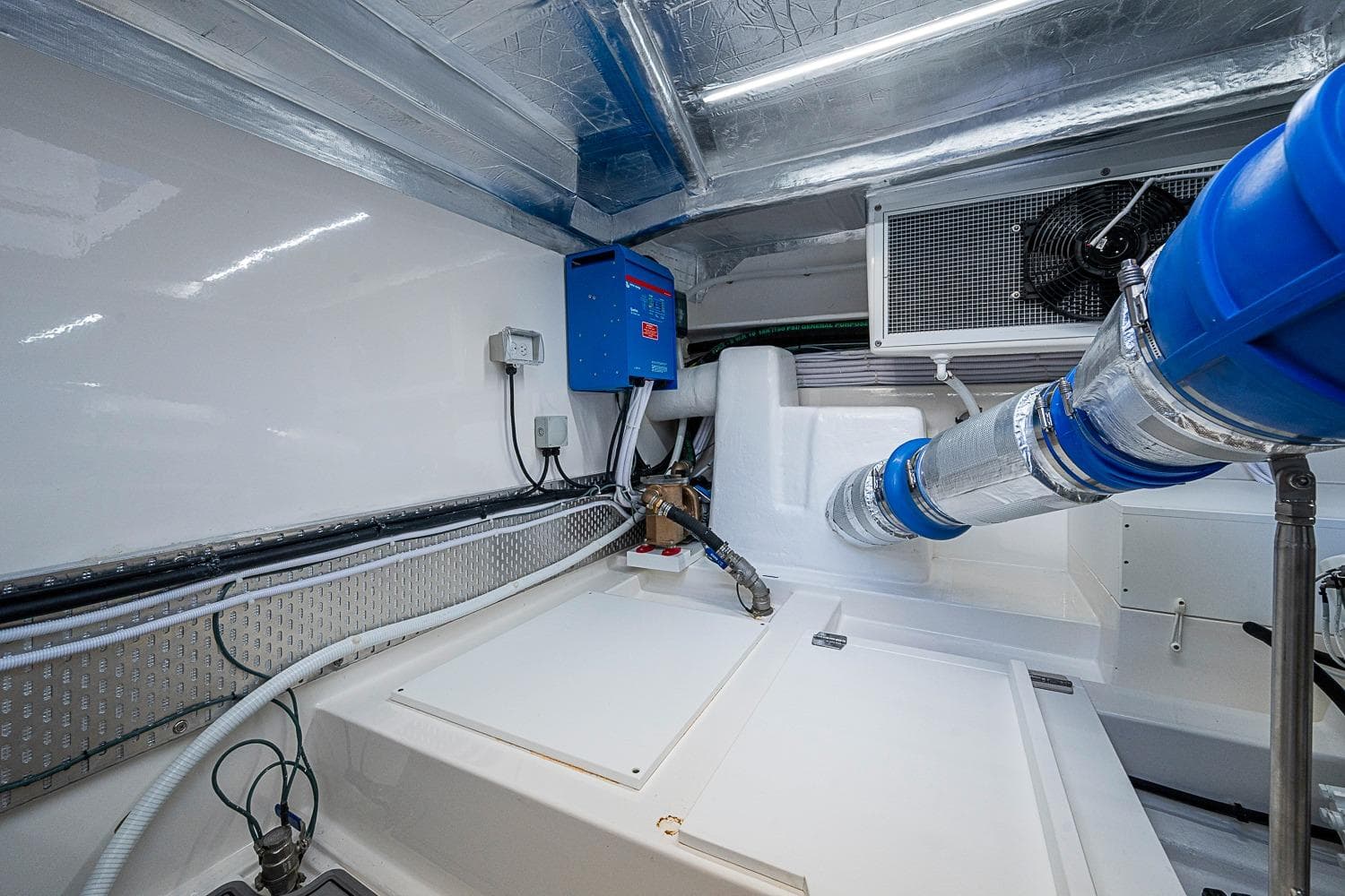 Engine room of 2026 Maritimo M50 yacht, featuring advanced ventilation and electrical systems.