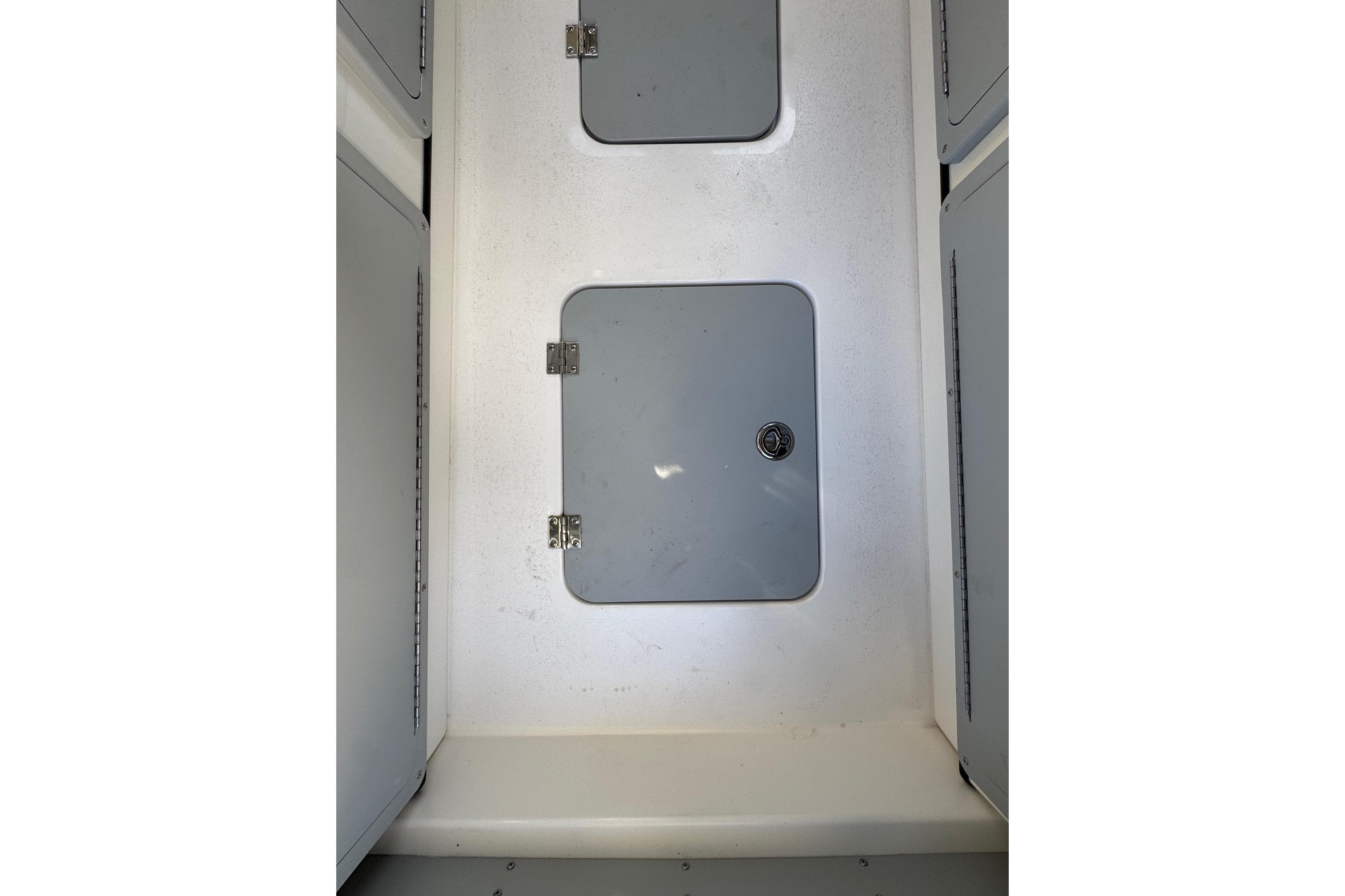 Interior storage compartment of 2026 Defiance Admiral 250 EX boat.