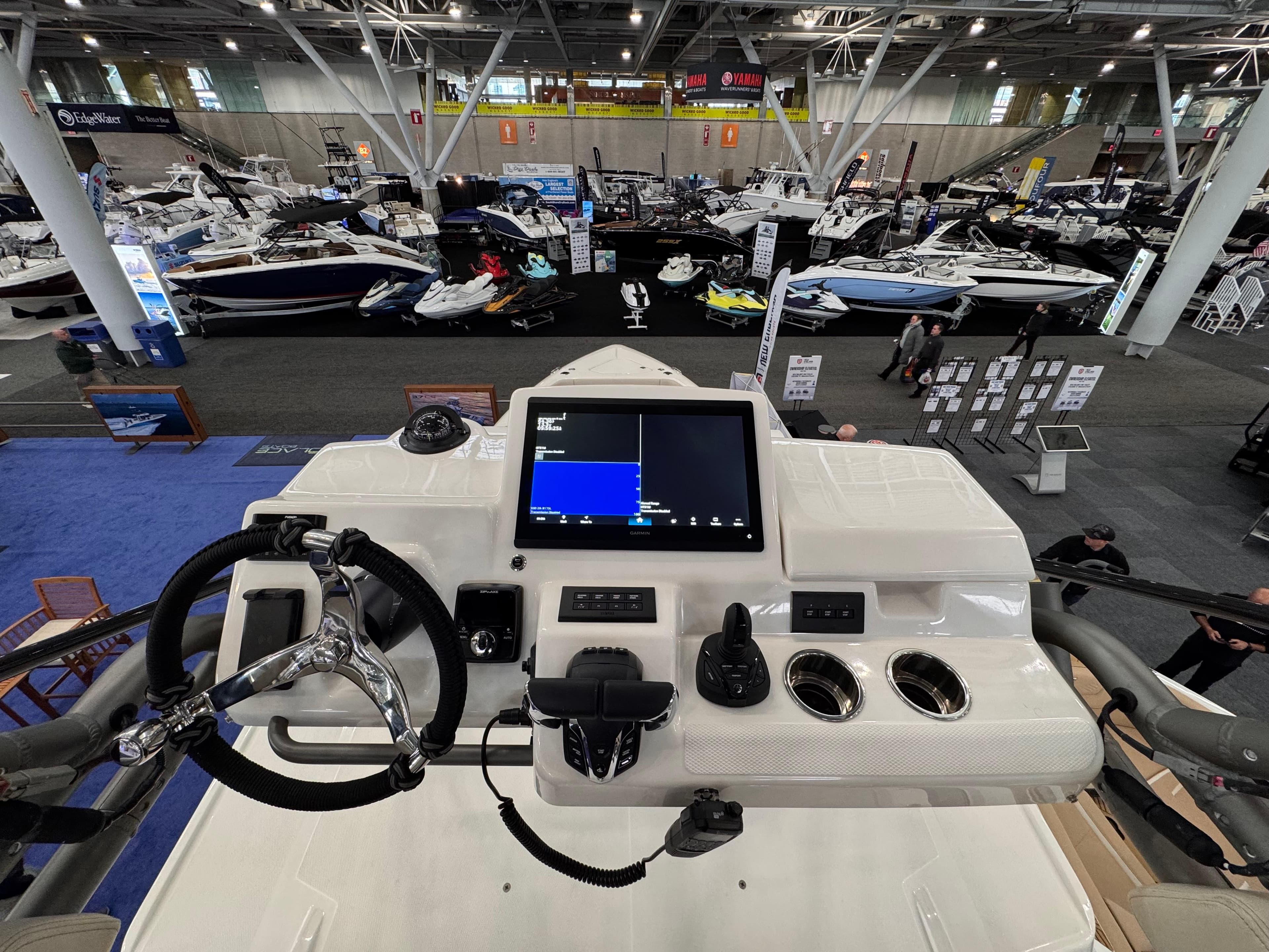 Helm of 2025 Solace 37 CS boat at indoor boat show.