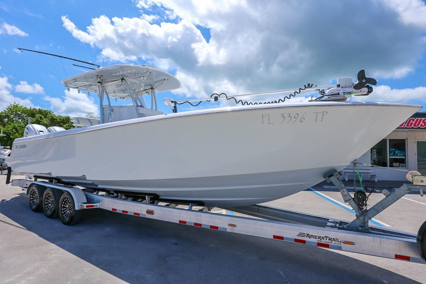 2024 Contender 35 ST boat on trailer under blue sky.