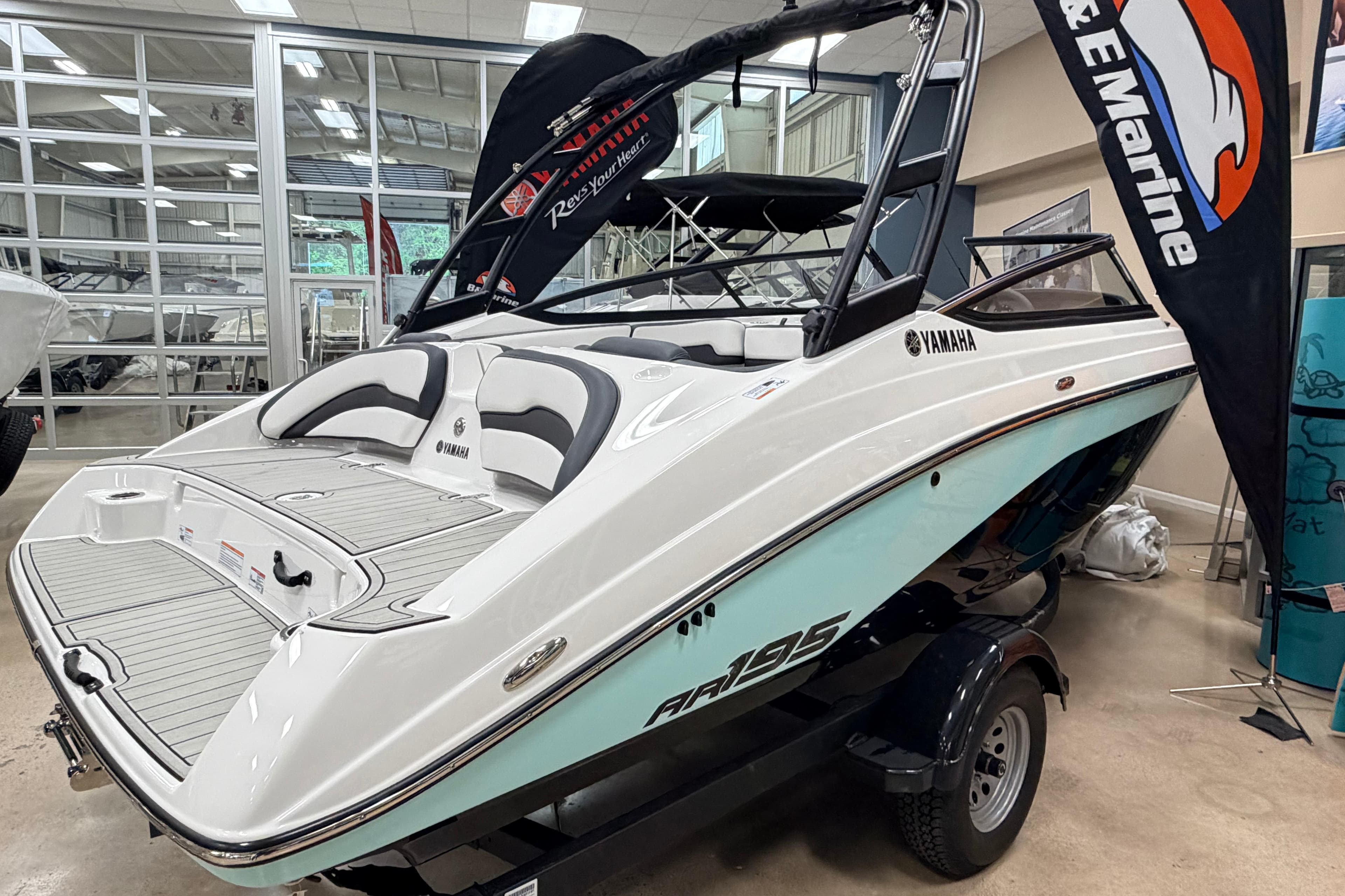 2026 Yamaha Boats AR195 displayed indoors, showcasing sleek design and modern features.