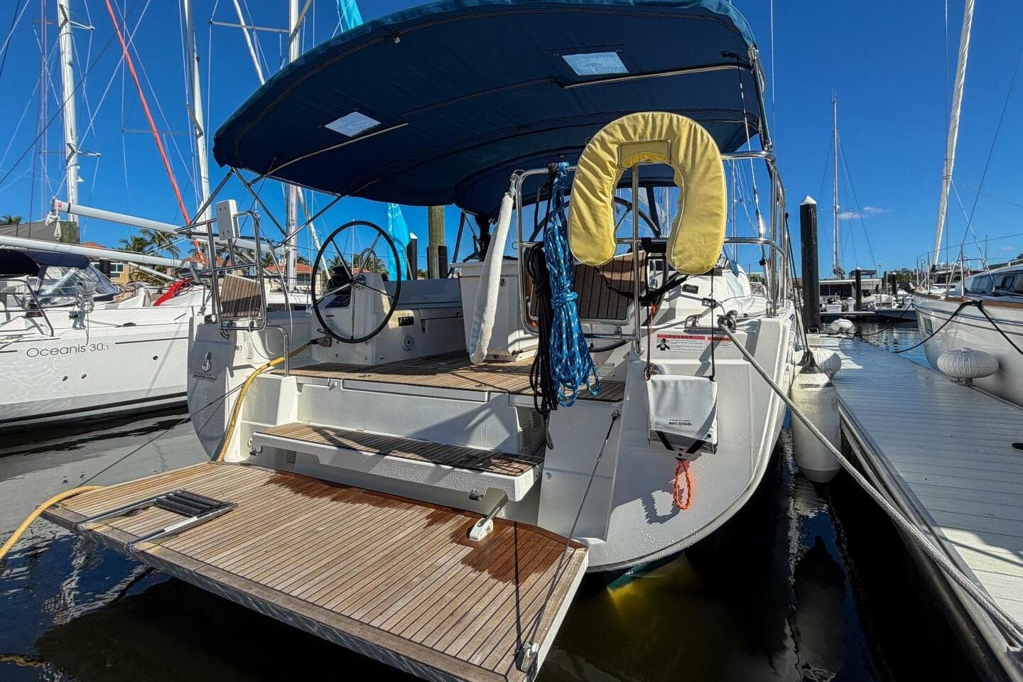 2022 Beneteau Oceanis 40.1 yacht docked at marina, rear view with open deck.