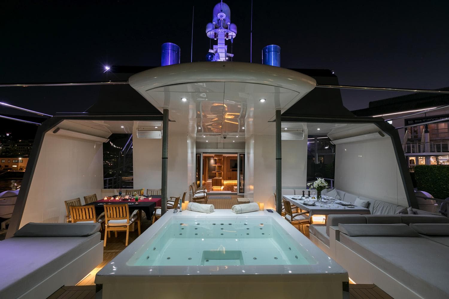 Luxurious yacht deck with jacuzzi, dining area, and seating, Richards Shipbuilders Expedition 1987.