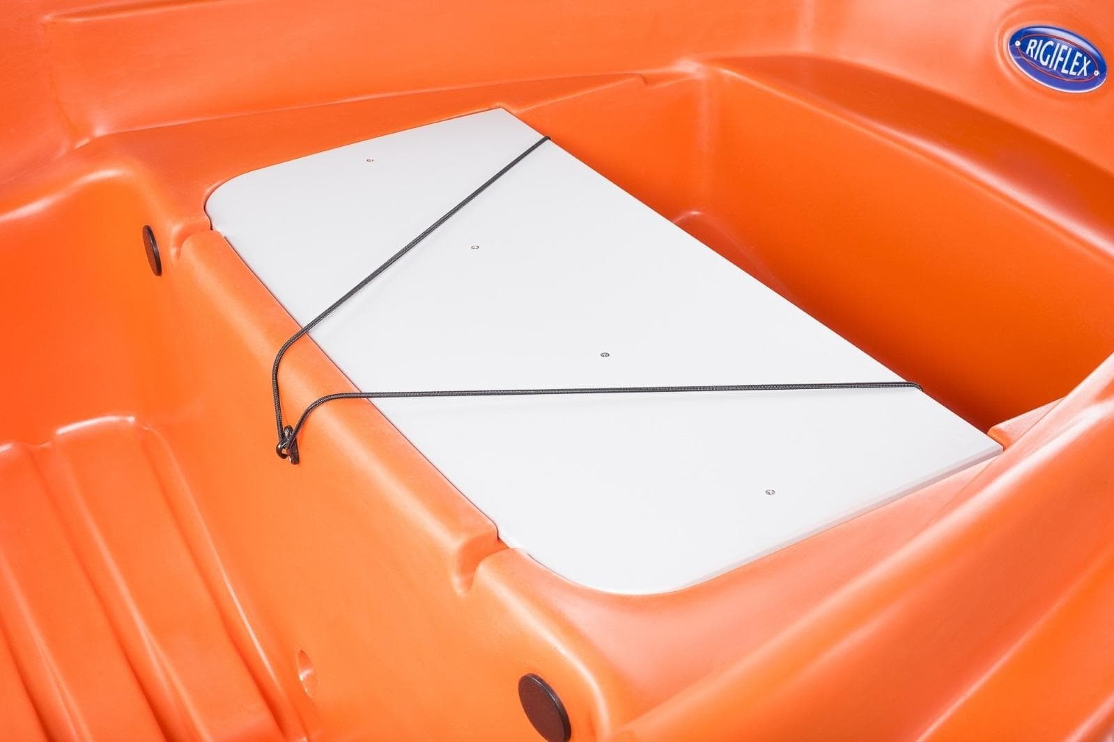 Orange Rigiflex Newmatic 360 boat interior, 2026 model, featuring a white storage compartment.