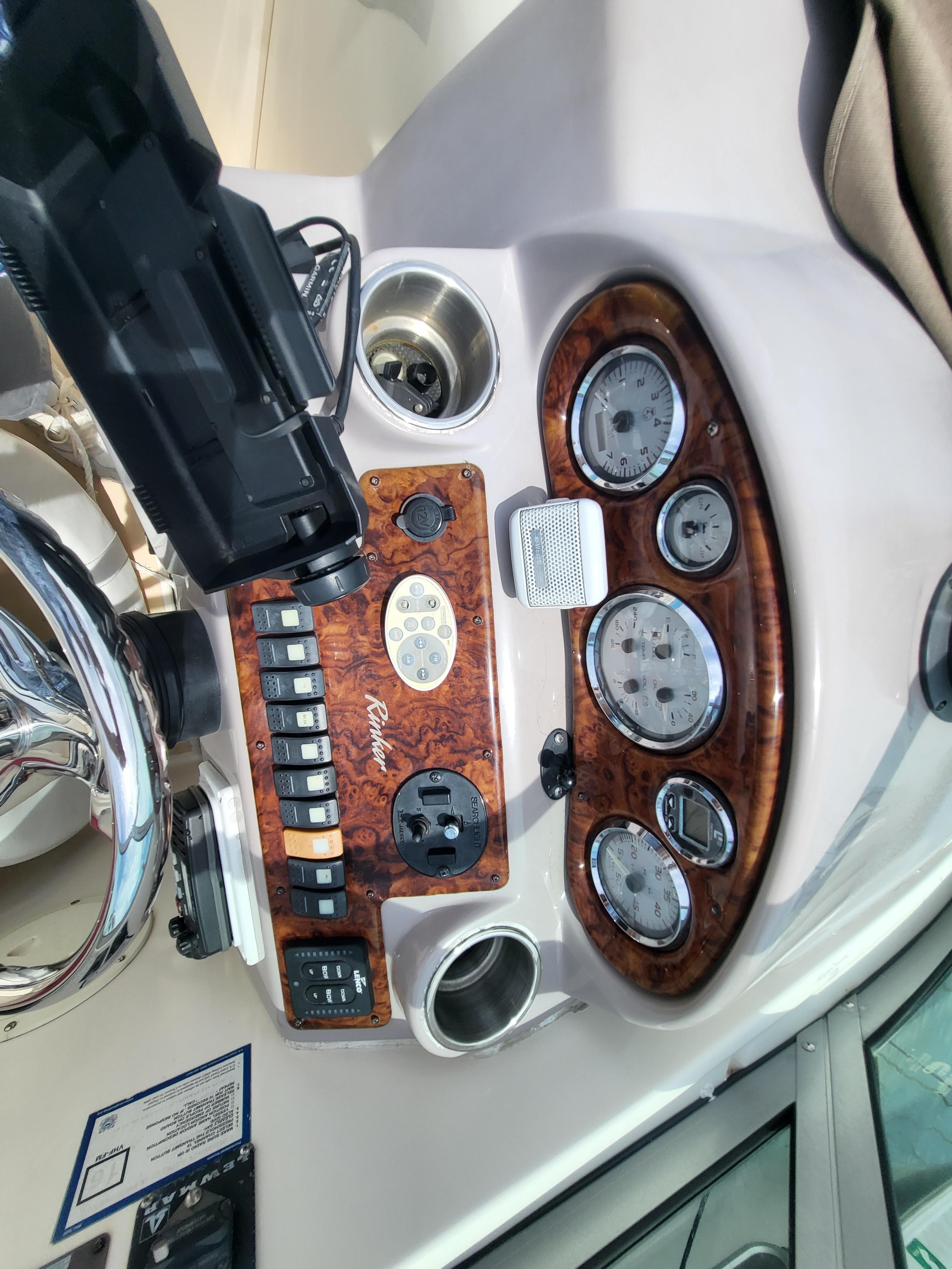2003 Rinker Fiesta Vee 270 dashboard with gauges and controls.