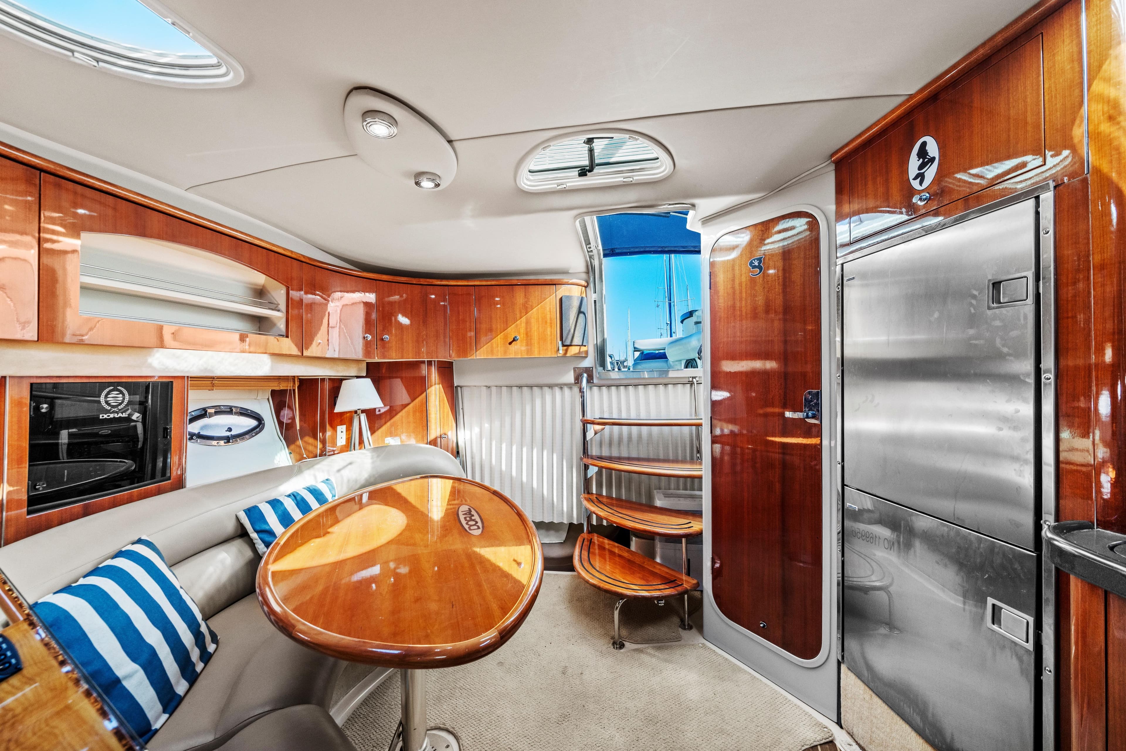 Luxurious interior of 2005 Doral 360se yacht with polished wood and modern amenities.