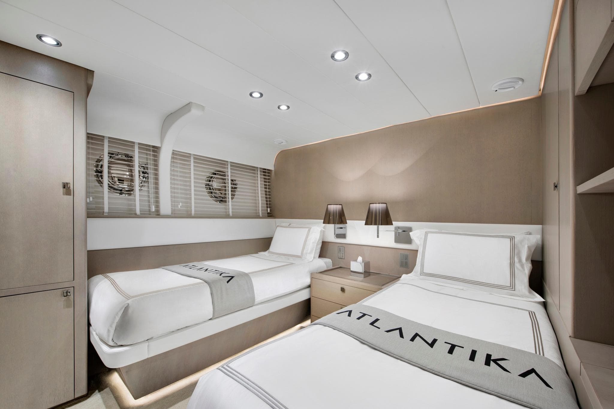 Luxurious twin cabin interior on 2013 CNT Castagnola Motorsailer yacht, featuring elegant decor and bedding.