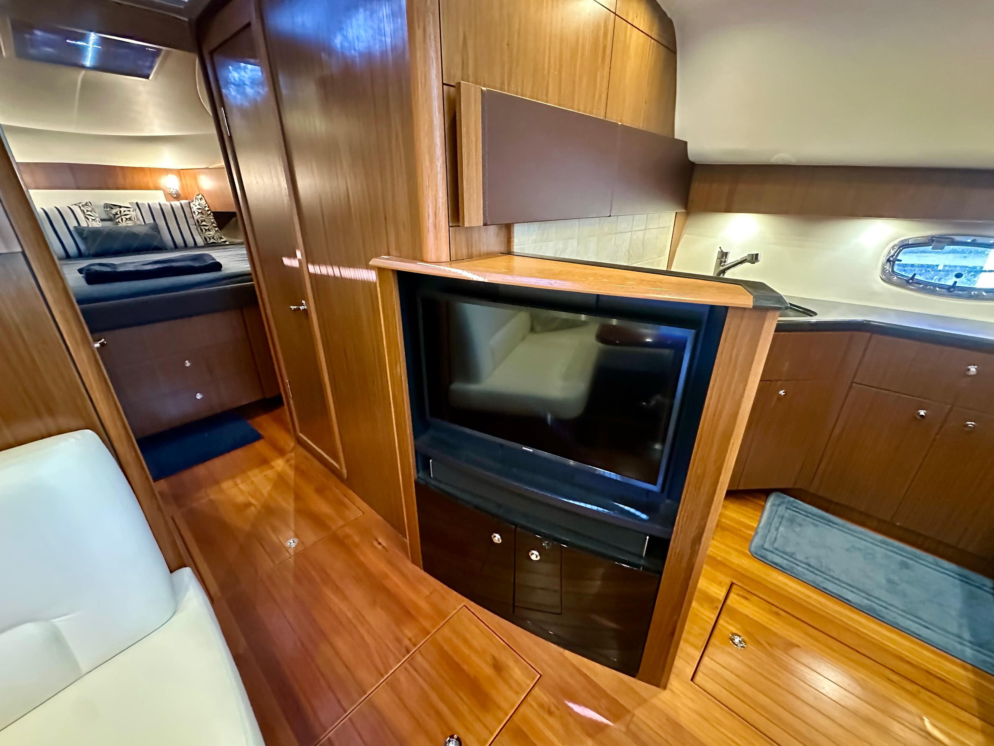 Luxurious interior of 2018 Tiara Yachts 4300 Open with wood finishes and modern amenities.