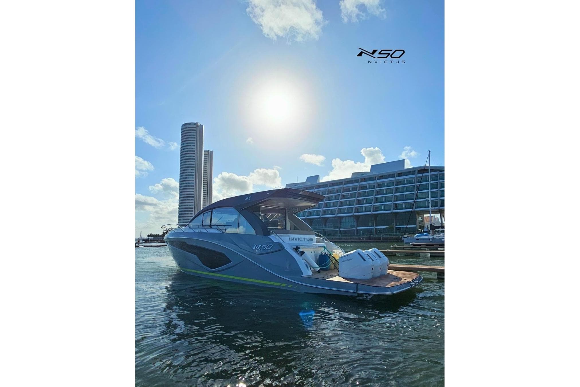 2025 NX Boats NX50 Invictus HT yacht docked in sunny marina with modern buildings.