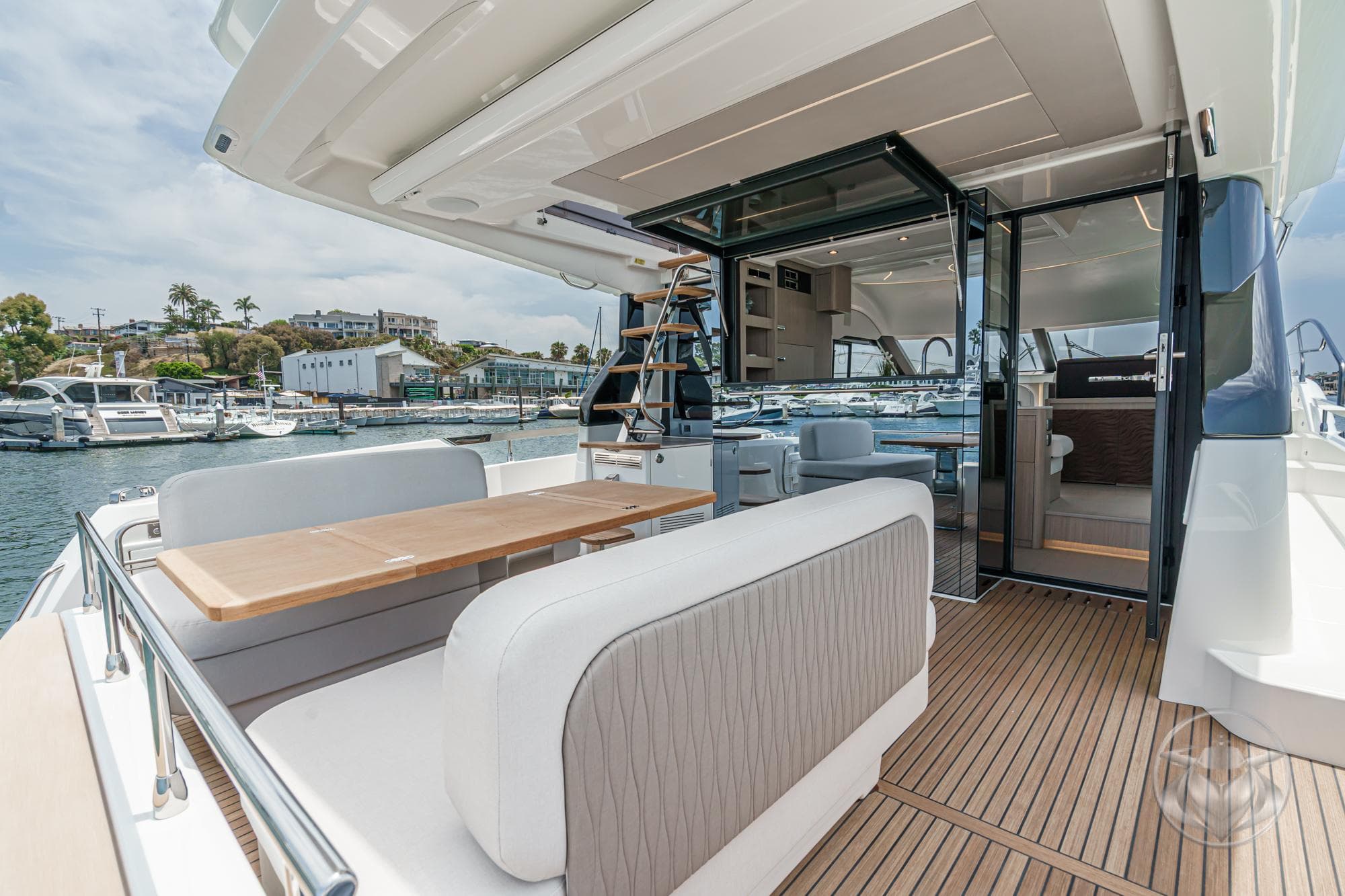 Luxury yacht Prestige F4.9 2025 with elegant outdoor seating and modern interior design.