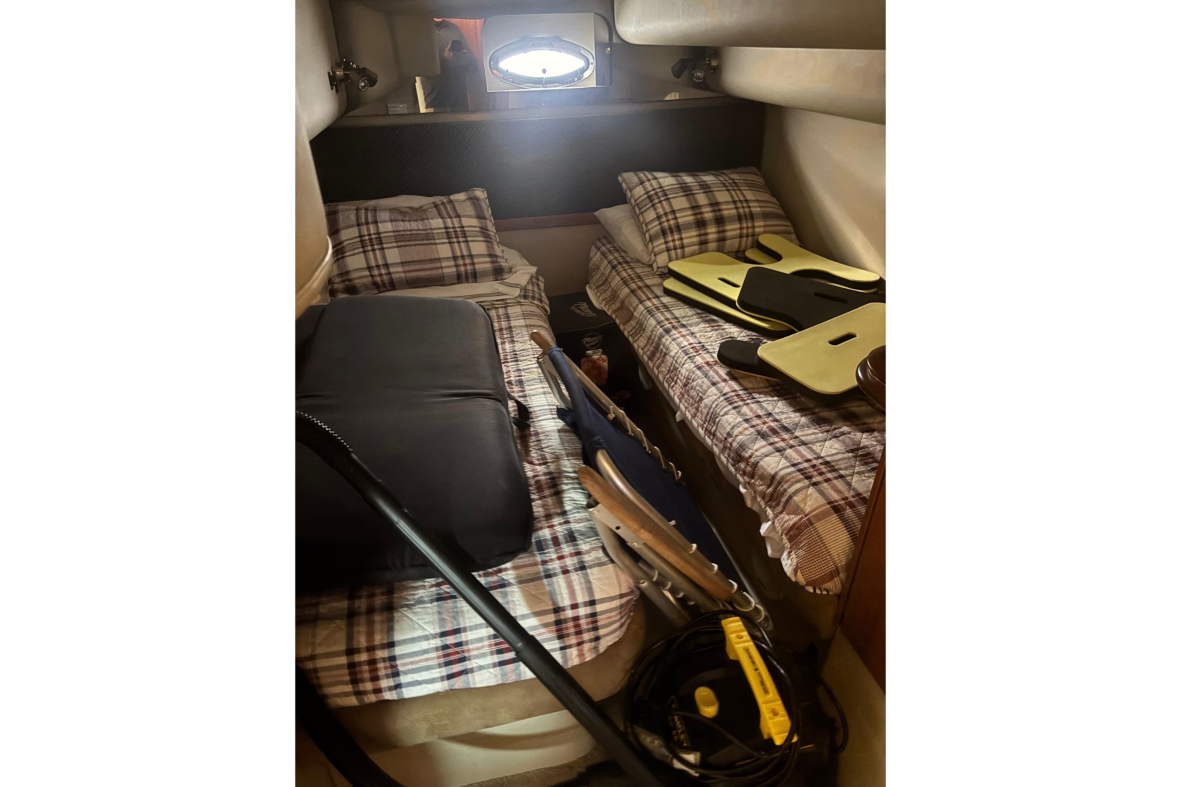 2003 Cruisers 4270 cabin with twin beds and plaid bedding.