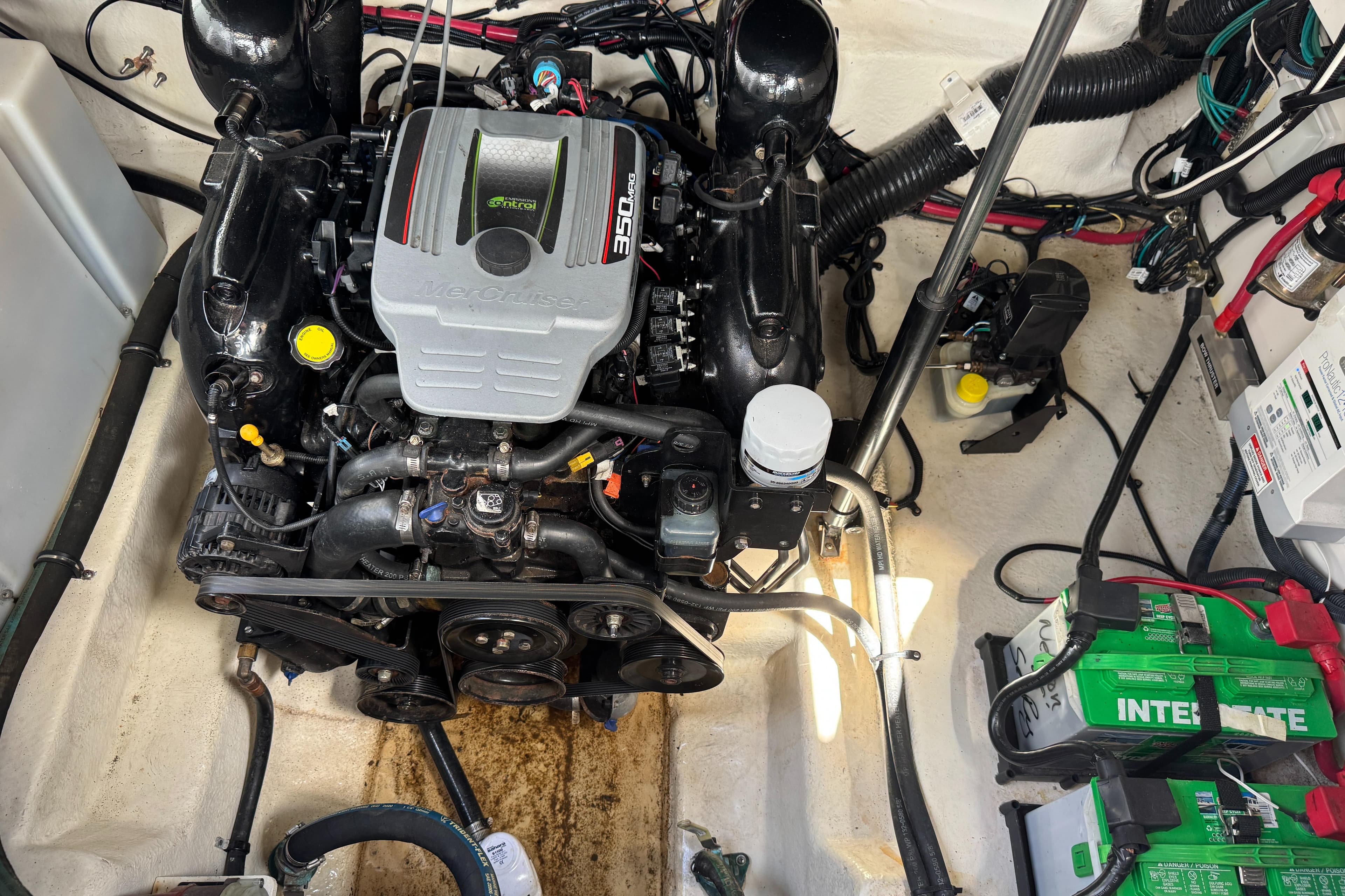 Engine compartment of a 2014 Sea Ray 280 Sundancer with MerCruiser 350 engine.