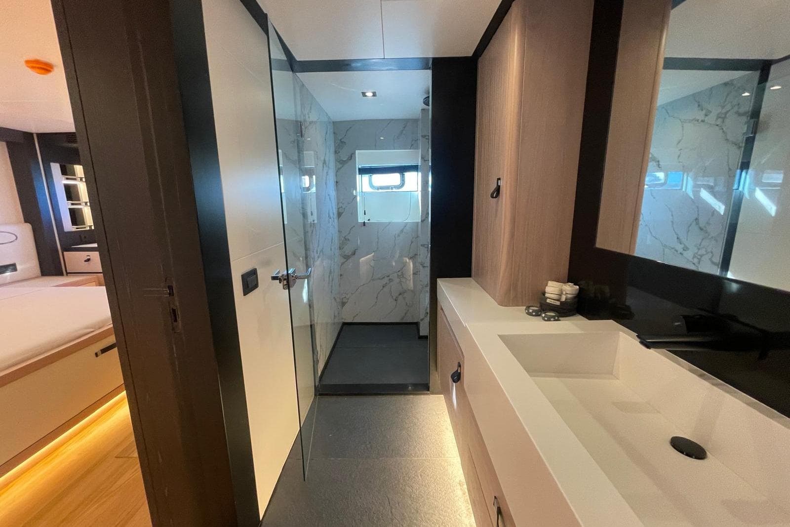 Luxurious 2024 Explorer ICE yacht bathroom with modern design and marble accents.
