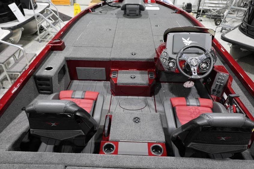 2026 Vexus AVX 2100 boat interior with red and gray seating, steering console, and storage compartments.