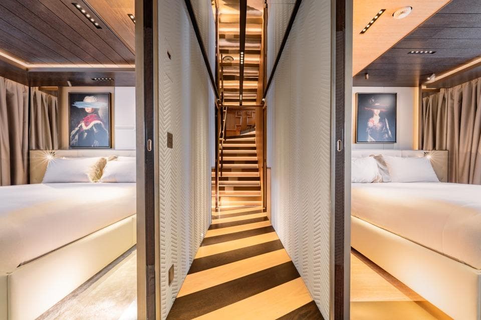 Luxurious interior of 2025 Admiral S-Force 55 yacht with elegant bedrooms and modern staircase.