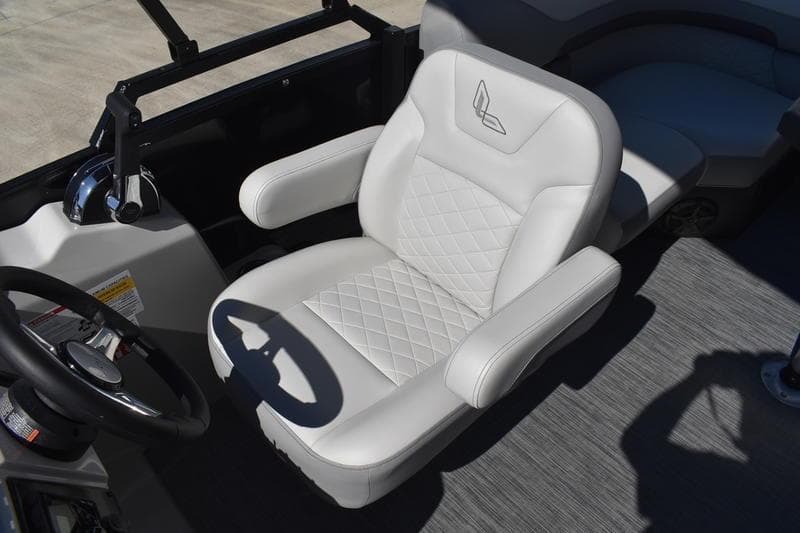 Captain's chair in 2026 Lowe SS 230 boat, featuring white upholstery and diamond stitching.