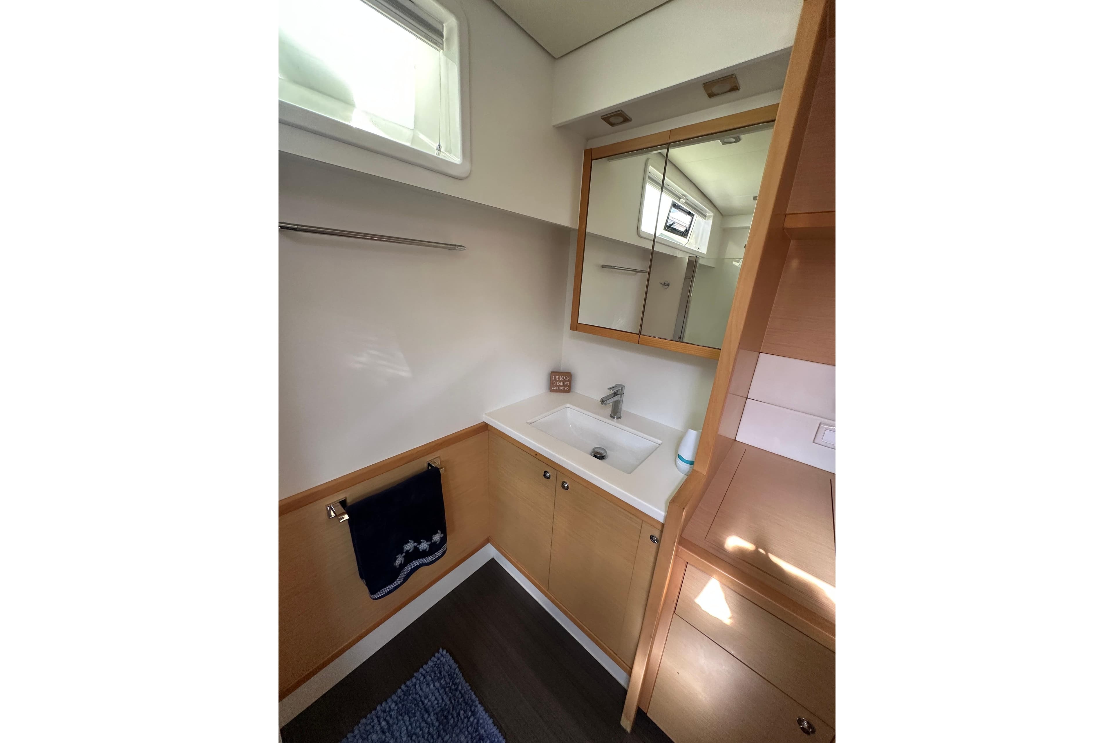 Modern bathroom interior of 2017 Lagoon 52 F yacht with sink and mirror.