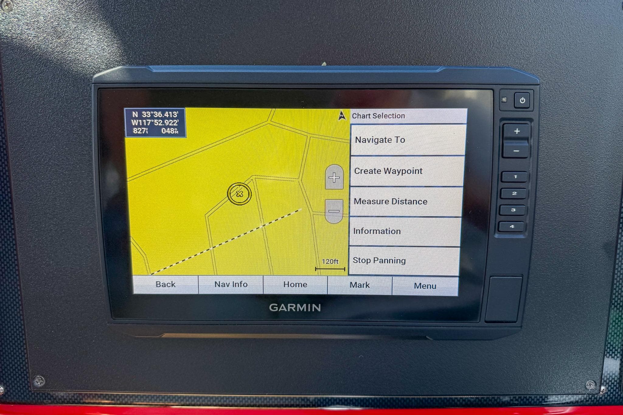 Garmin navigation system on 2002 Hallett Custom High Performance Express Cruiser displaying map coordinates.