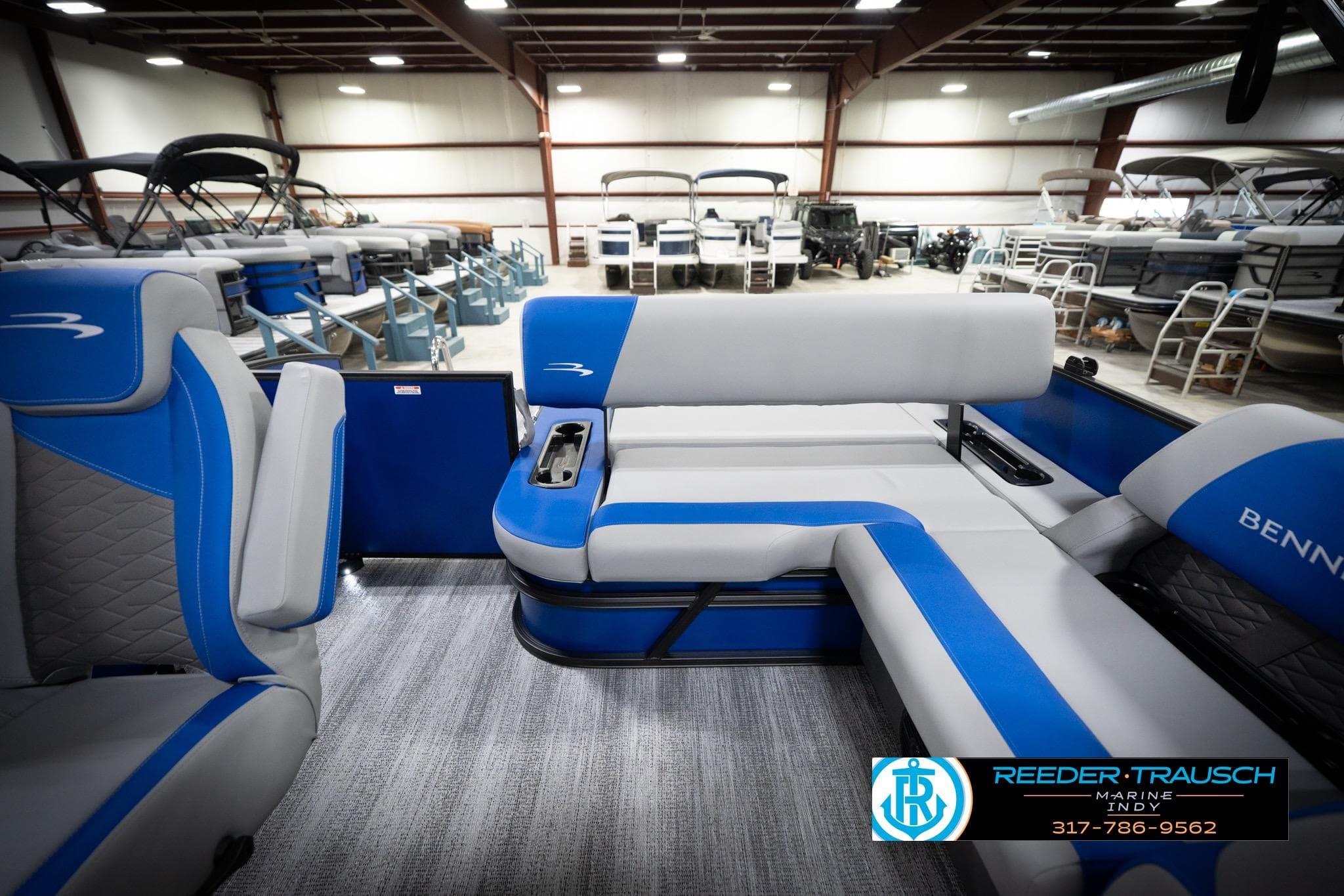 Interior of 2026 Bennington 22 SSB pontoon boat with blue and gray seating.