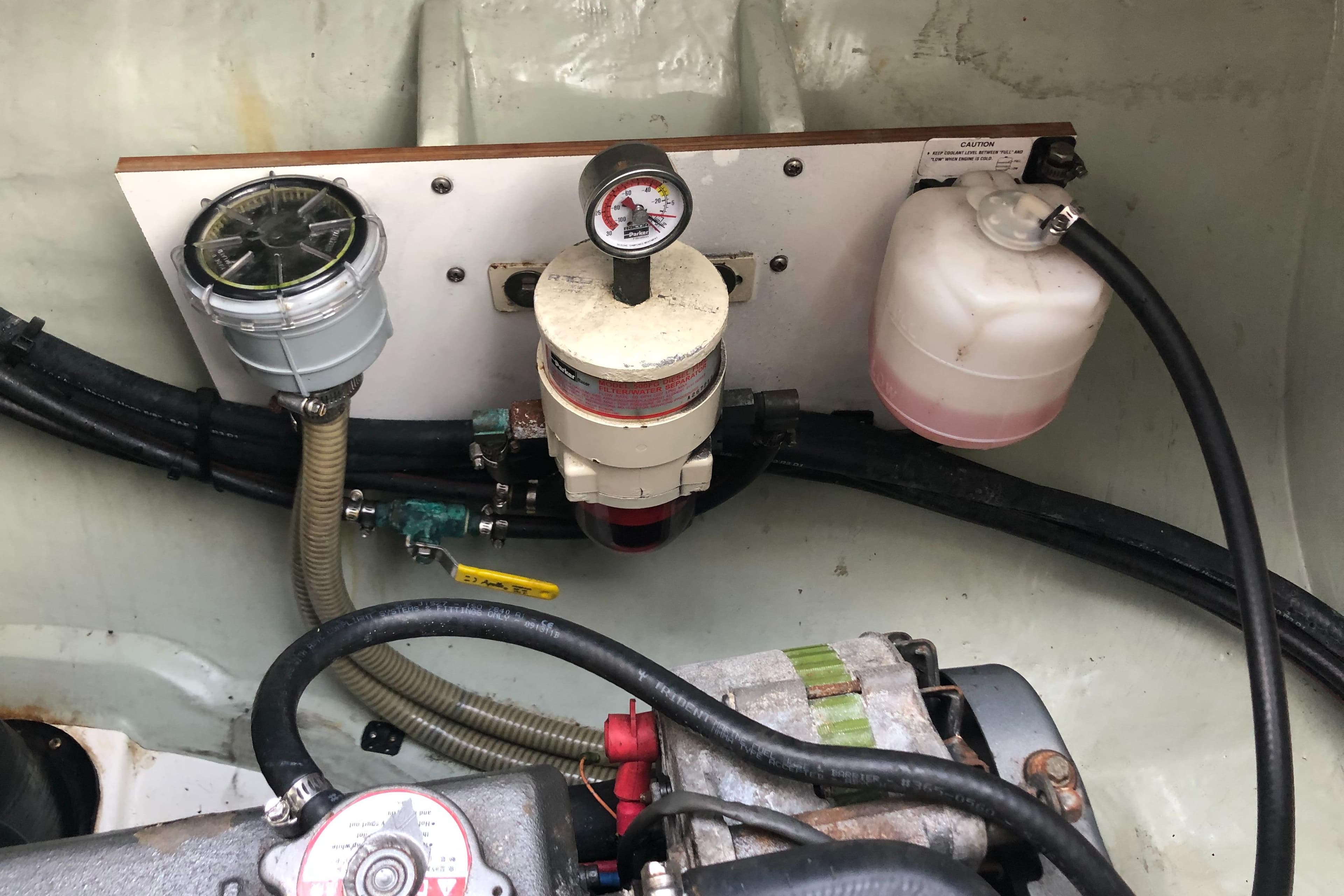 Engine compartment of a 2013 Leopard 39 Owner's Version with fuel filter and gauge.