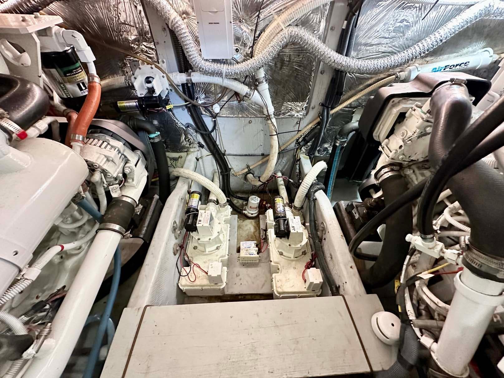 Engine room of a 2007 Meridian 411 Sedan, showcasing mechanical components and wiring.