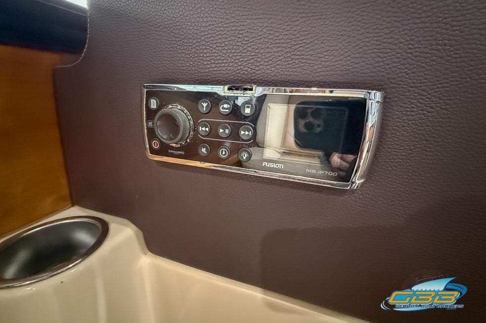 Fusion MS-IP700 marine stereo on 2013 Cutwater C-28 boat dashboard.