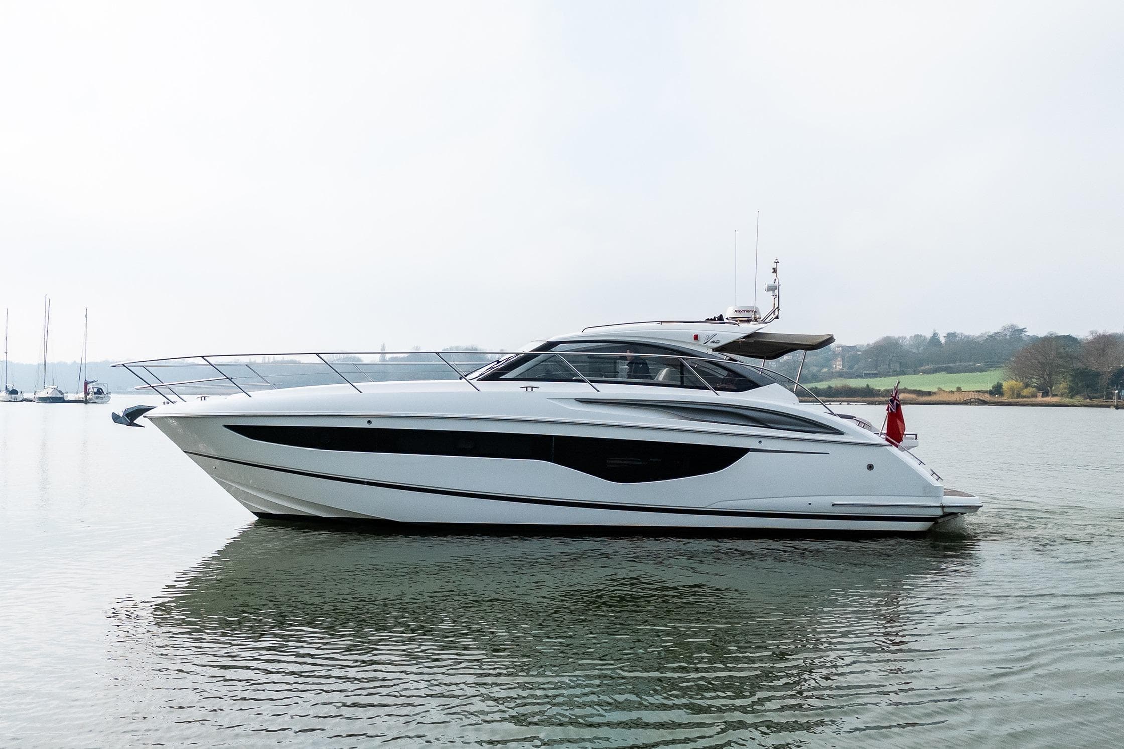 2018 Princess V40 yacht on calm water, showcasing sleek design and luxury features.