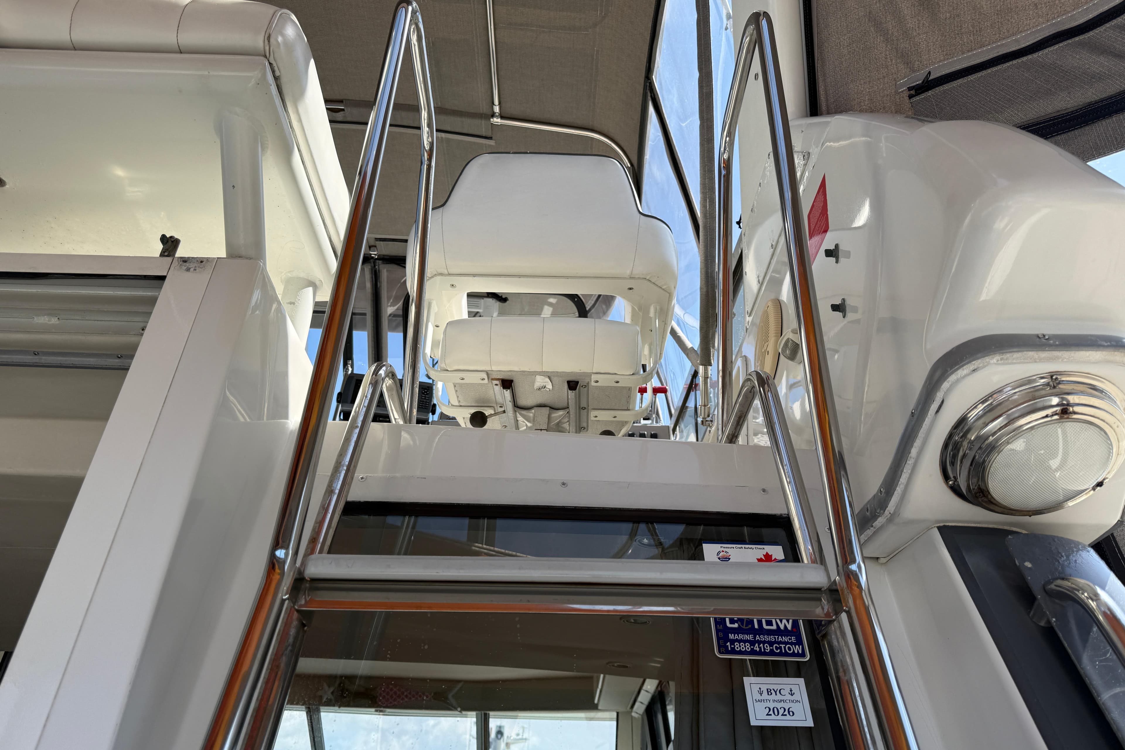 Stairs leading to the helm of a 1996 Carver 370 Voyager yacht.