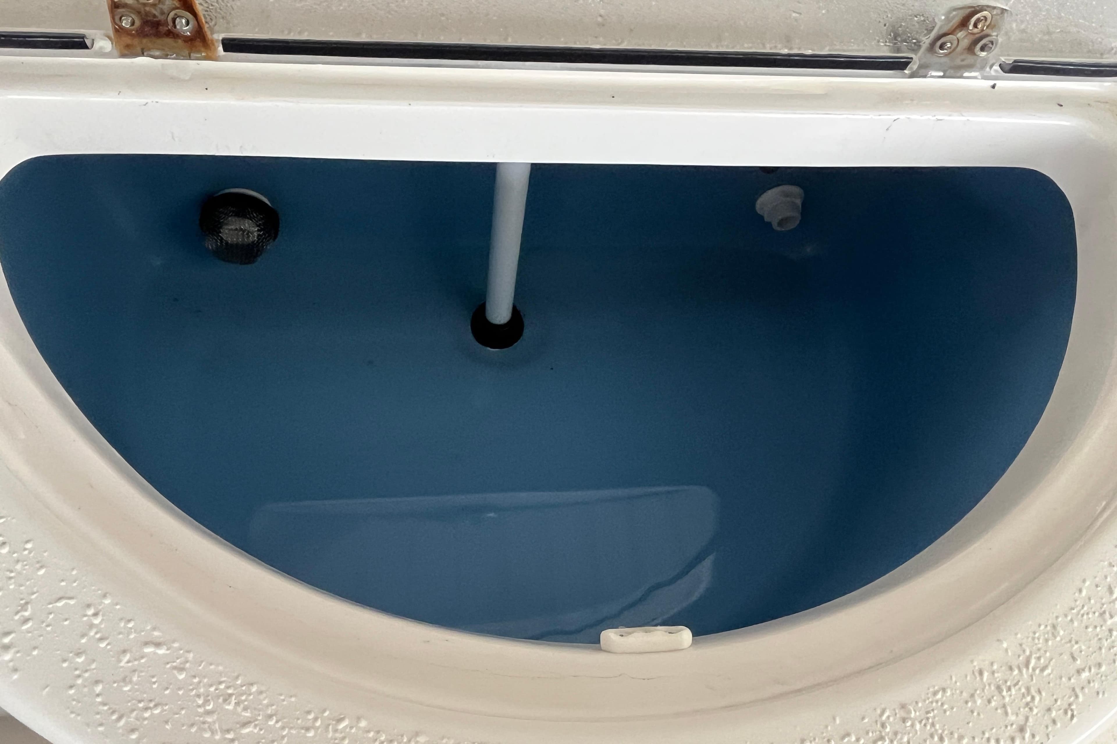 2024 Sea Chaser 21 LX livewell interior with water and drainage system.