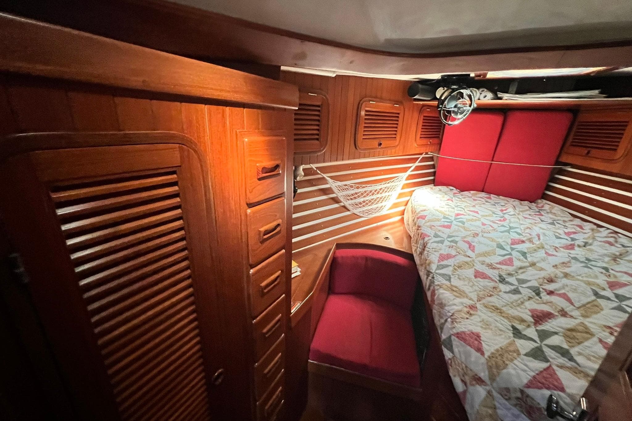 Interior of a 1988 Tayana Vancouver 42 yacht with wooden furnishings.