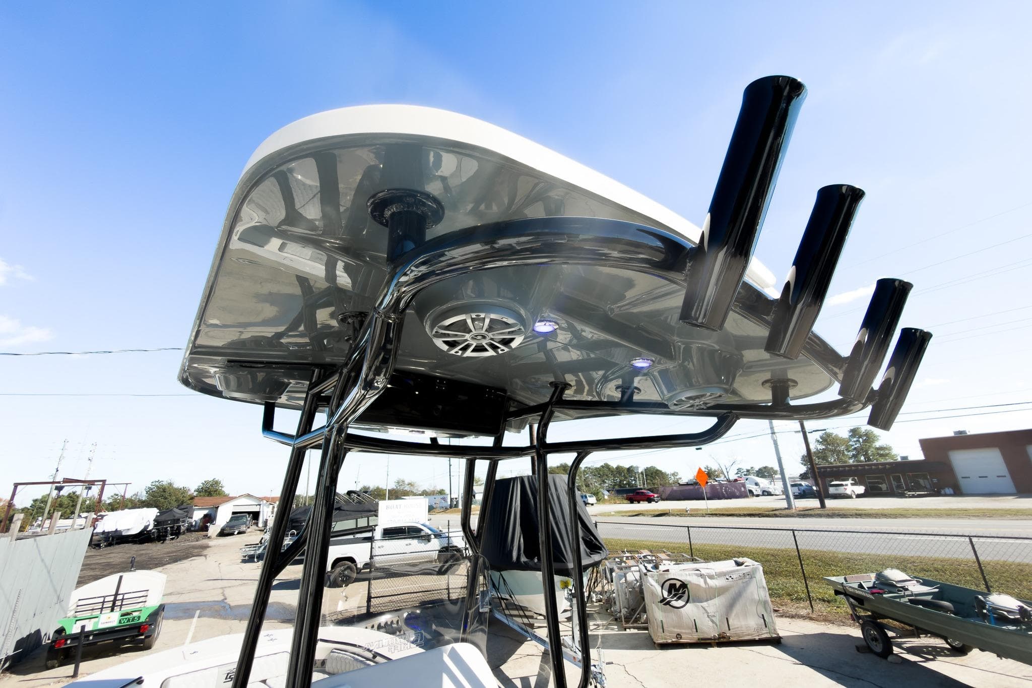 2026 Carolina Skiff 22 Ultra Elite boat with T-top and rod holders.