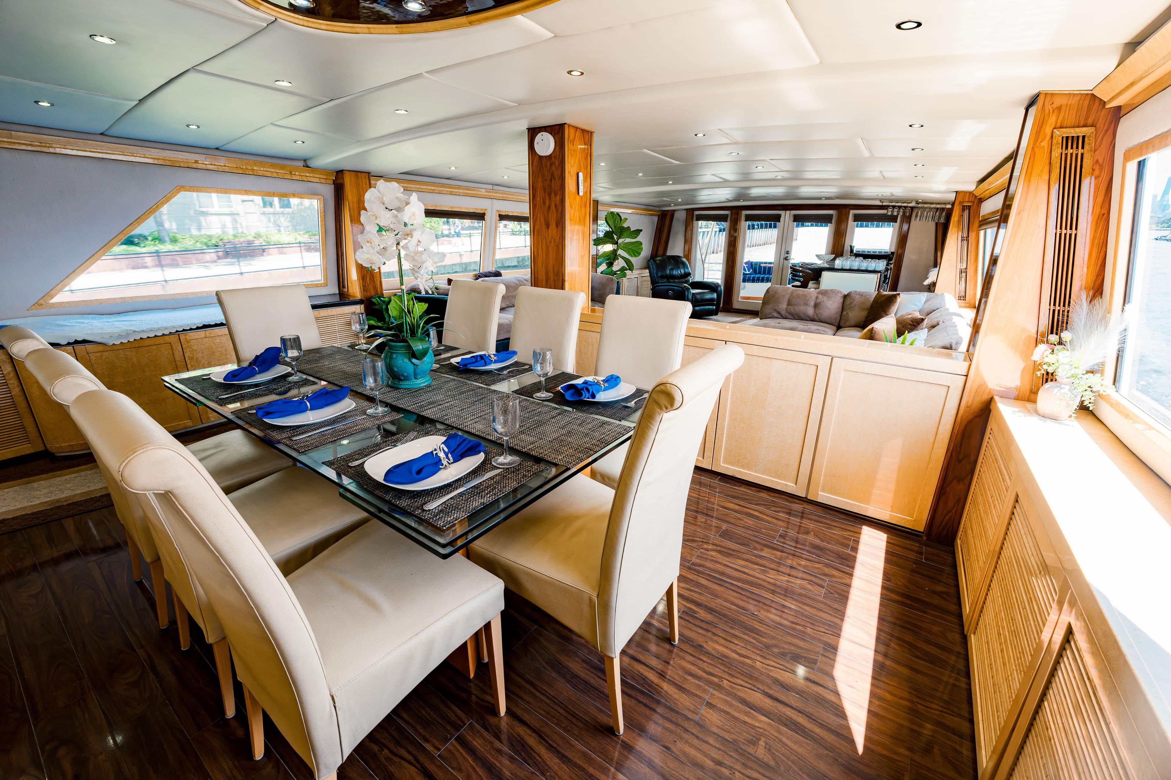 Luxurious dining area on a 1987 Guy Couach 97 yacht with elegant table setting.