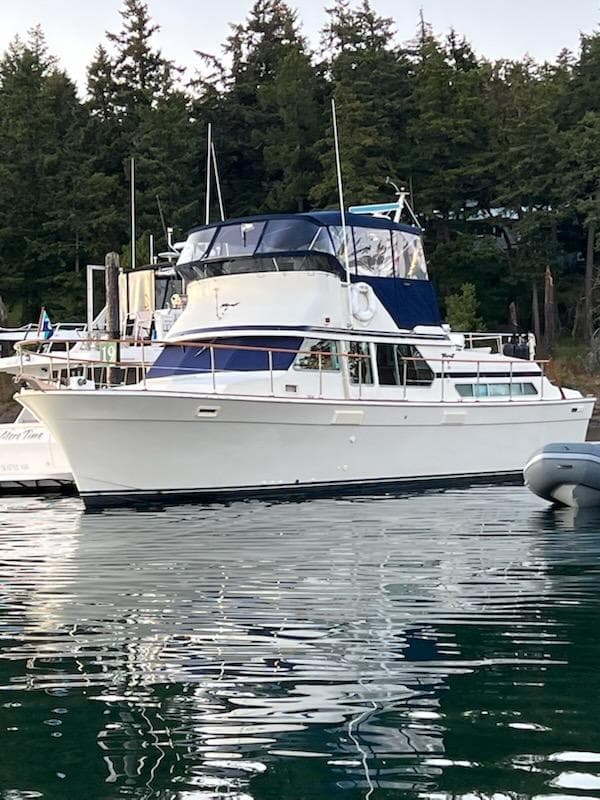 1978 Tollycraft 40 Tri-Cabin MY yacht docked in a serene marina setting.