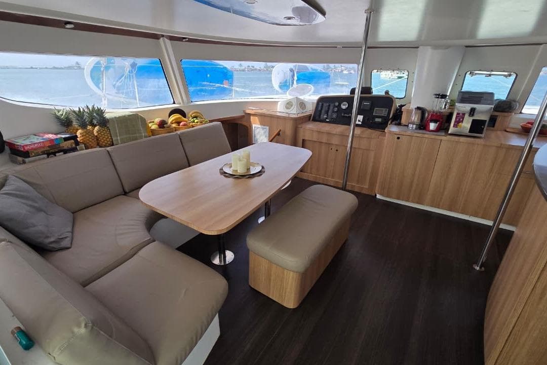 Luxurious interior of 2007 Fountaine Pajot Salina 48 catamaran with modern kitchen and seating area.