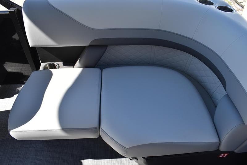 Luxurious seating on 2026 Lowe SS 230 boat, featuring sleek gray upholstery and modern design.