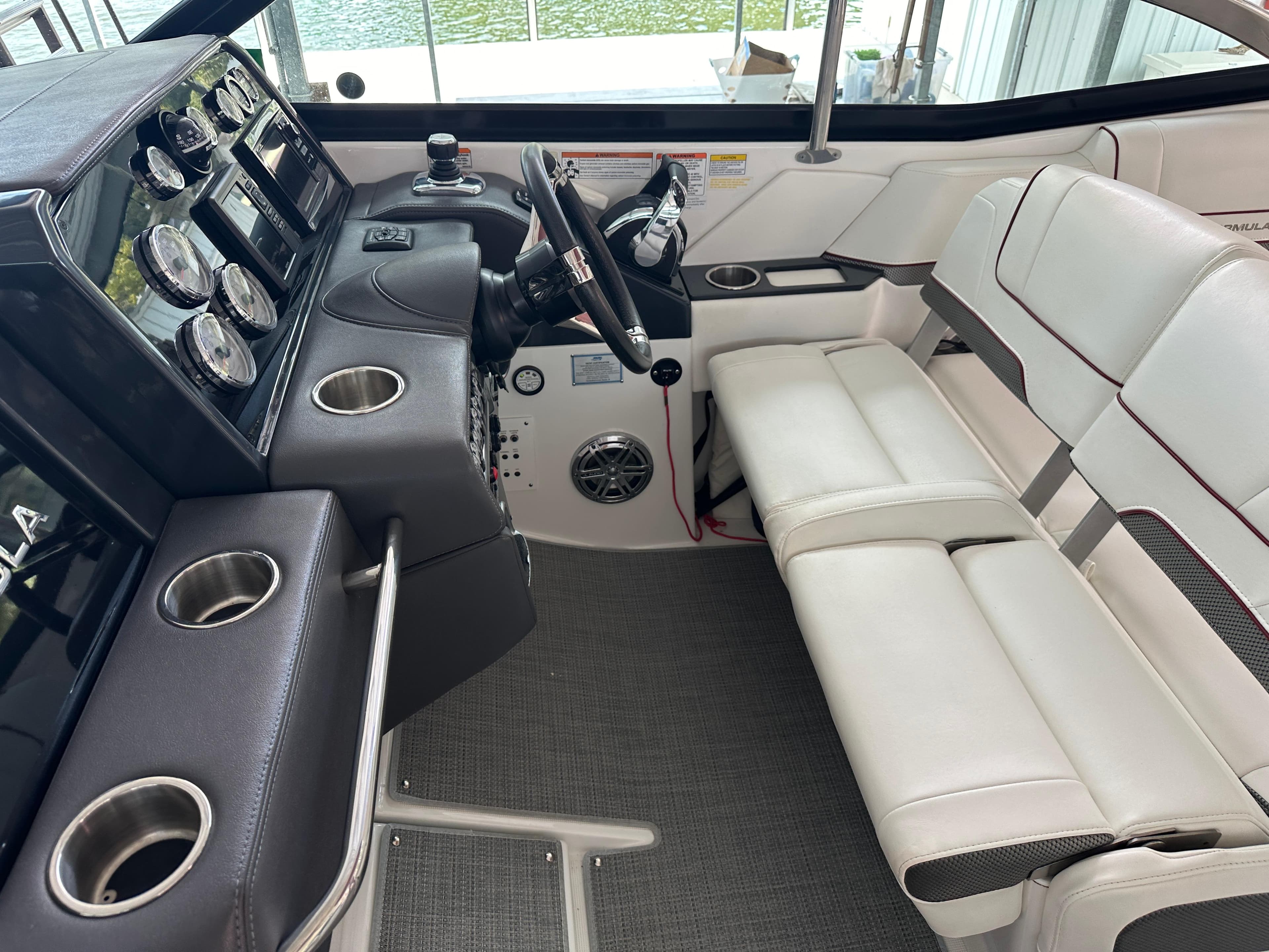 Interior of 2016 Formula 330 Crossover Bowrider with steering wheel and seating.
