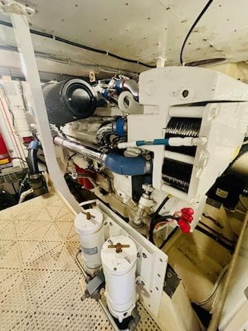 Engine room of 2006 Neptunus 55 Cabrio yacht, showcasing mechanical components and systems.