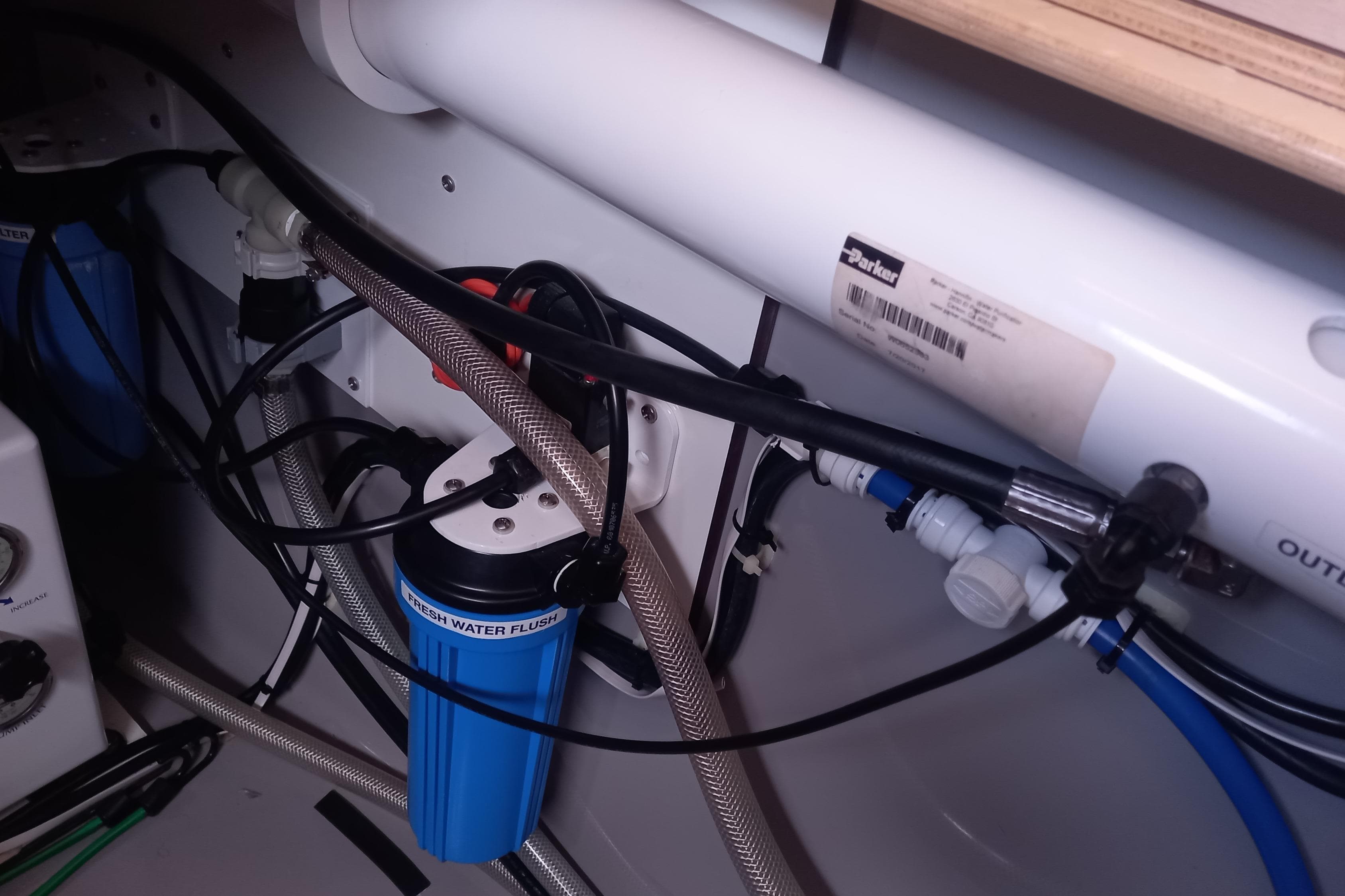 Water filtration system in a 2019 Leopard 45 yacht, featuring pipes and connectors.
