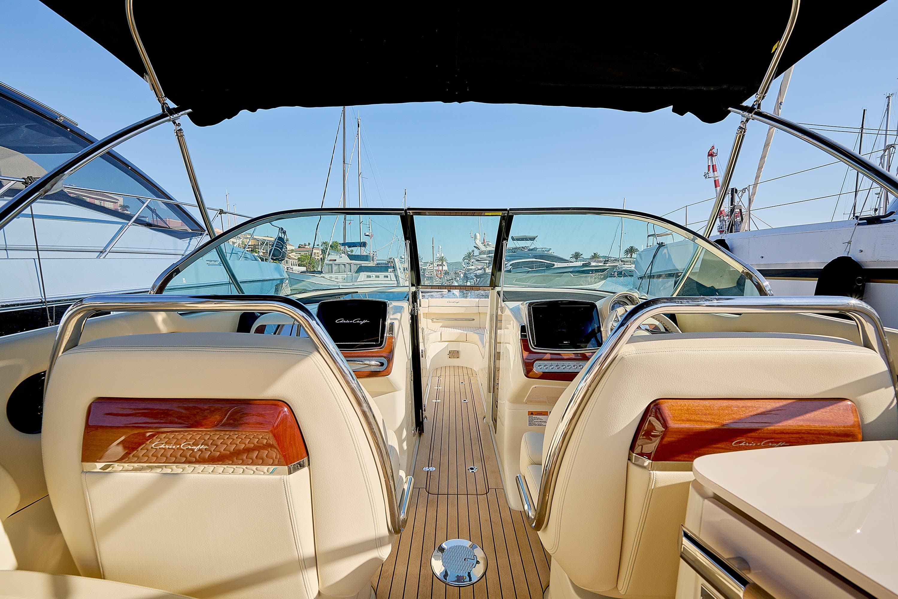 Interior view of 2025 Chris-Craft Launch 31 GT boat, featuring luxurious seating and dashboard.