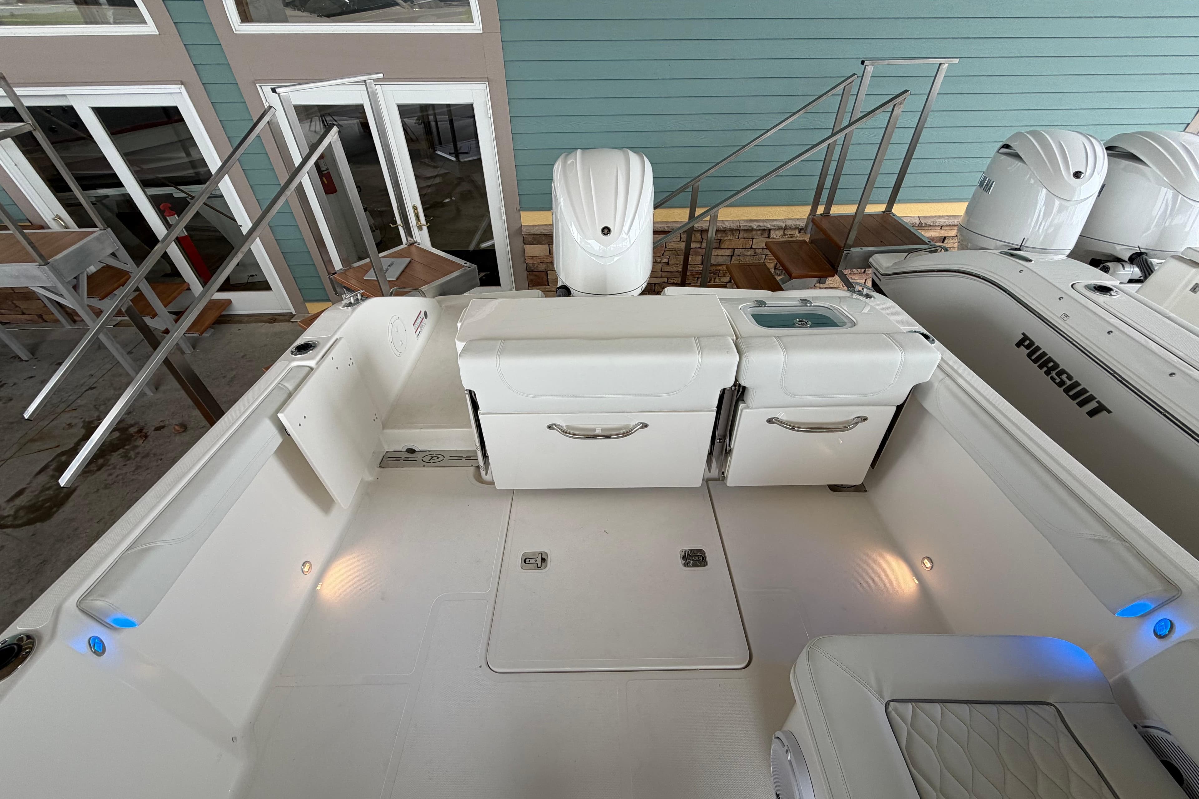 2026 Pursuit DC 246 Dual Console boat interior with seating and storage compartments.